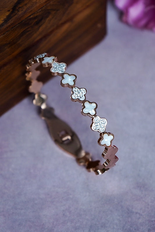 Bracelet with floral designs on a textured surface by hitesh bangles