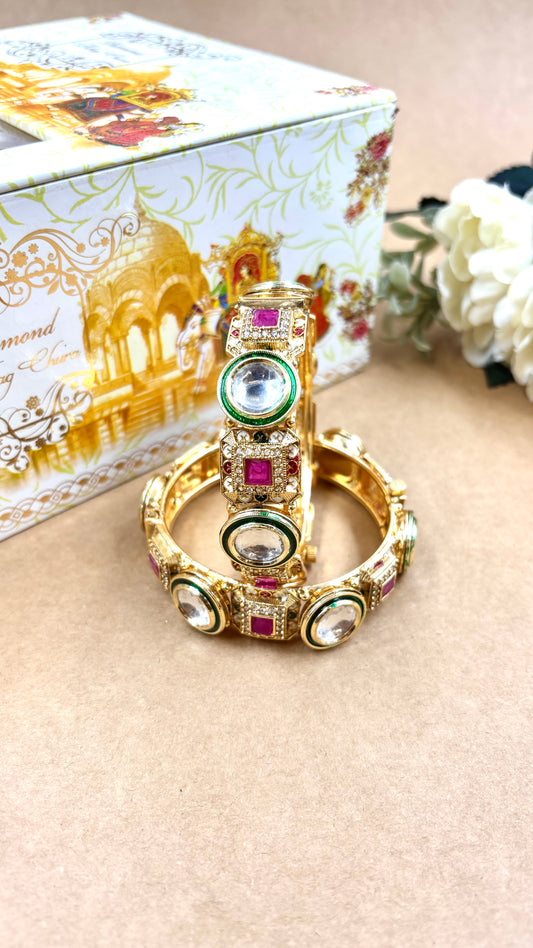 Decorative bangles with gemstones on a beige surface, with a decorative box in the background by hitesh bangles