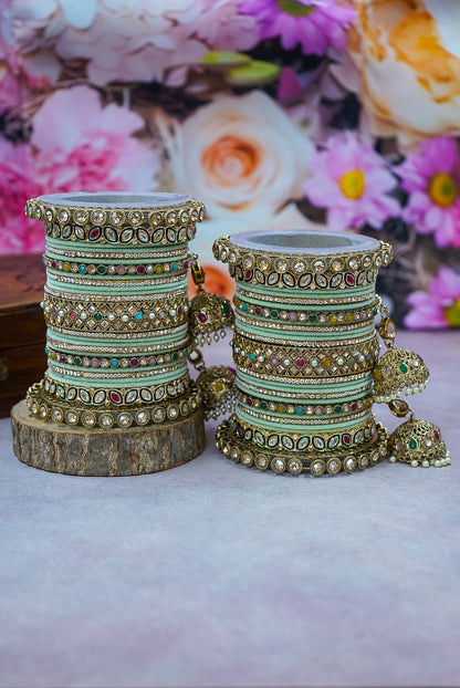 Decorative bangles on stands with a floral background by hitesh bangles