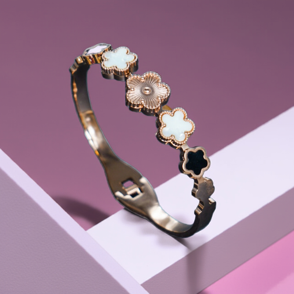 Gold bracelet with floral designs on a geometric background by hitesh bangles