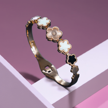 Gold bracelet with floral designs on a geometric background by hitesh bangles