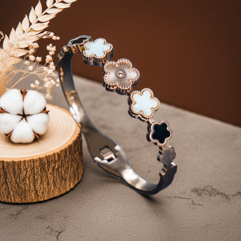 Decorative headband with floral designs on a textured surface with cotton and wood elements by hitesh bangles