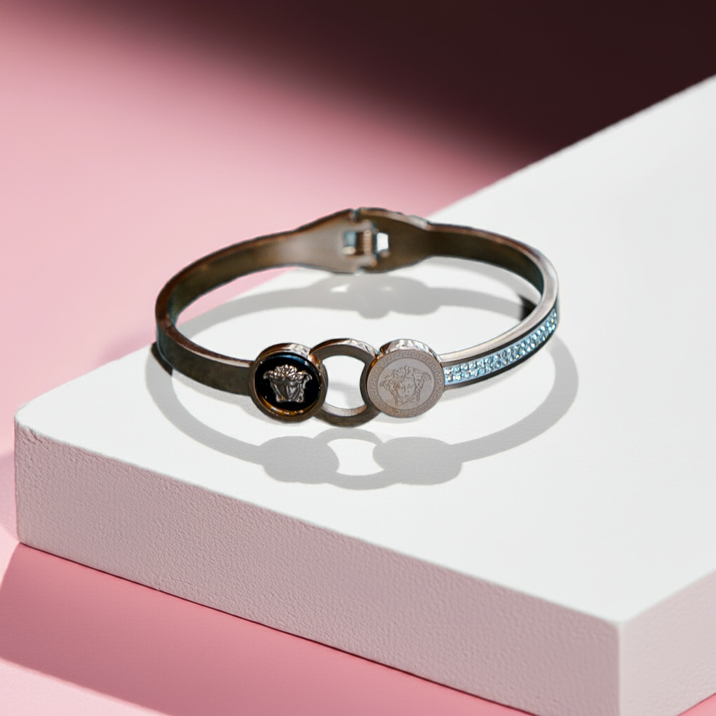 Multicolored bracelet with brand logo on a white and pink background by hitesh bangles