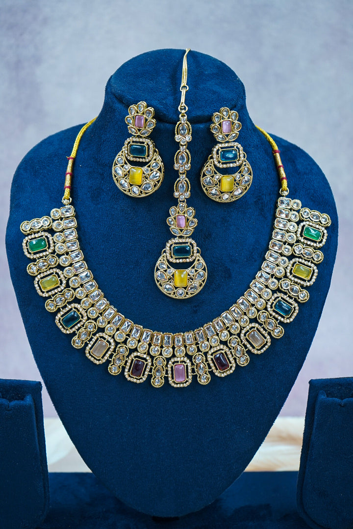Jewelry set with necklace and earrings on a blue stand by hitesh bangles