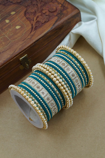 Set of decorative bangles on a wooden box by hitesh bangles
