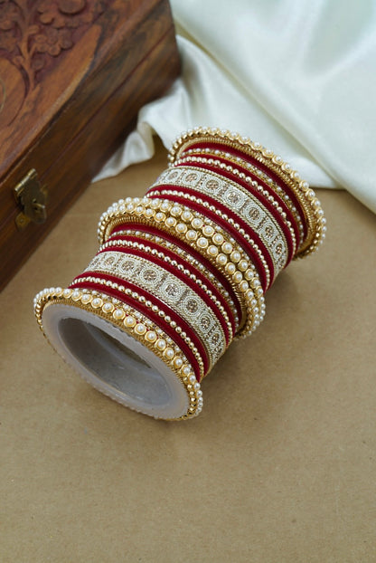 Roll of decorative ribbon with intricate patterns on a neutral background by hitesh bangles