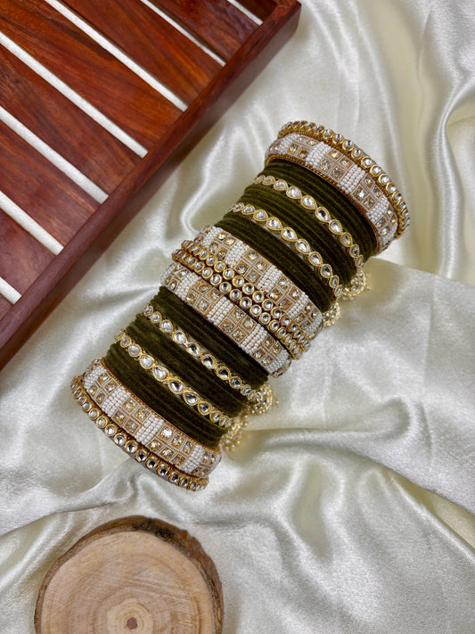 Set of decorative bangles on a white fabric background by hitesh bangles