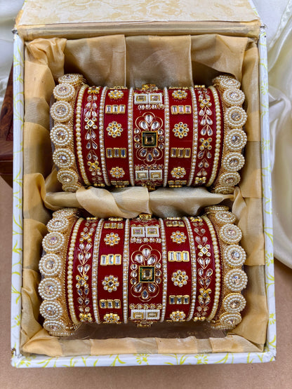 Set of red and gold bangles in a decorative box by hitesh bangles