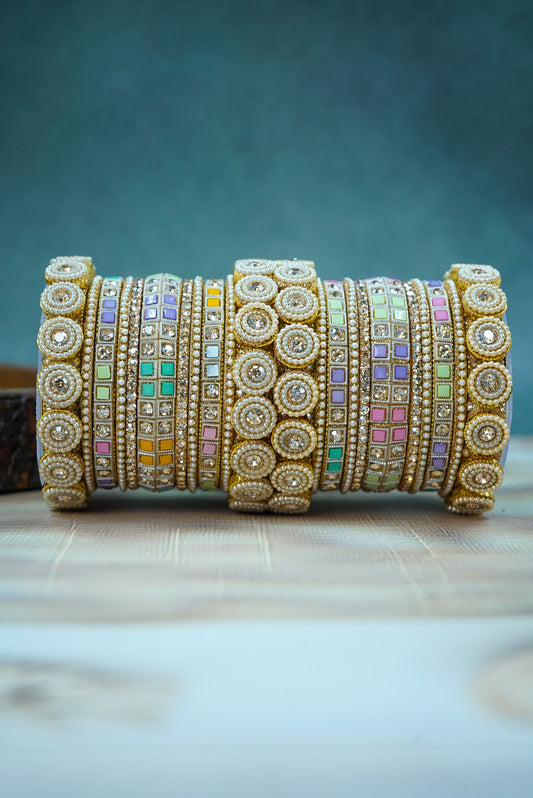 Set of colorful beaded bracelets on a wooden surface with a blurred background by hitesh bangles