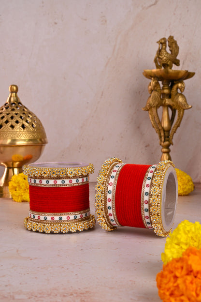 Decorative red and gold containers with floral and metallic background by hitesh bangles