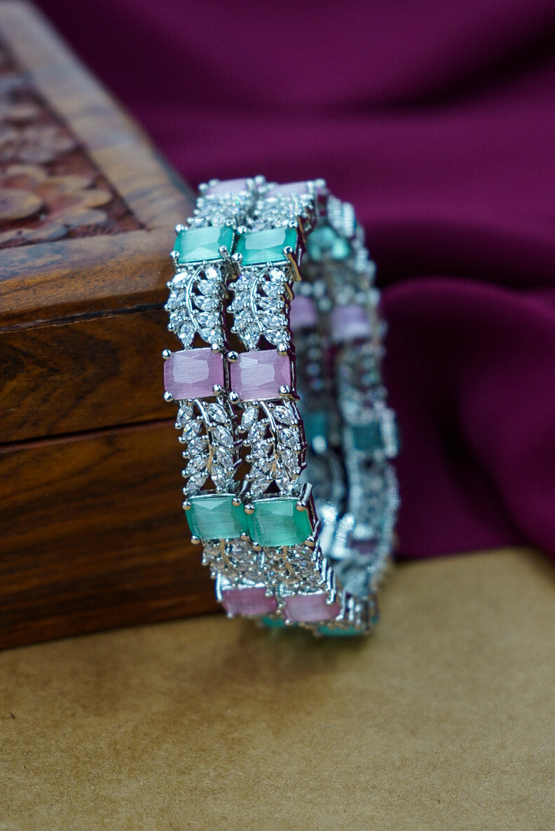 Decorative bracelet with gemstones on a textured surface by Hitesh bangles