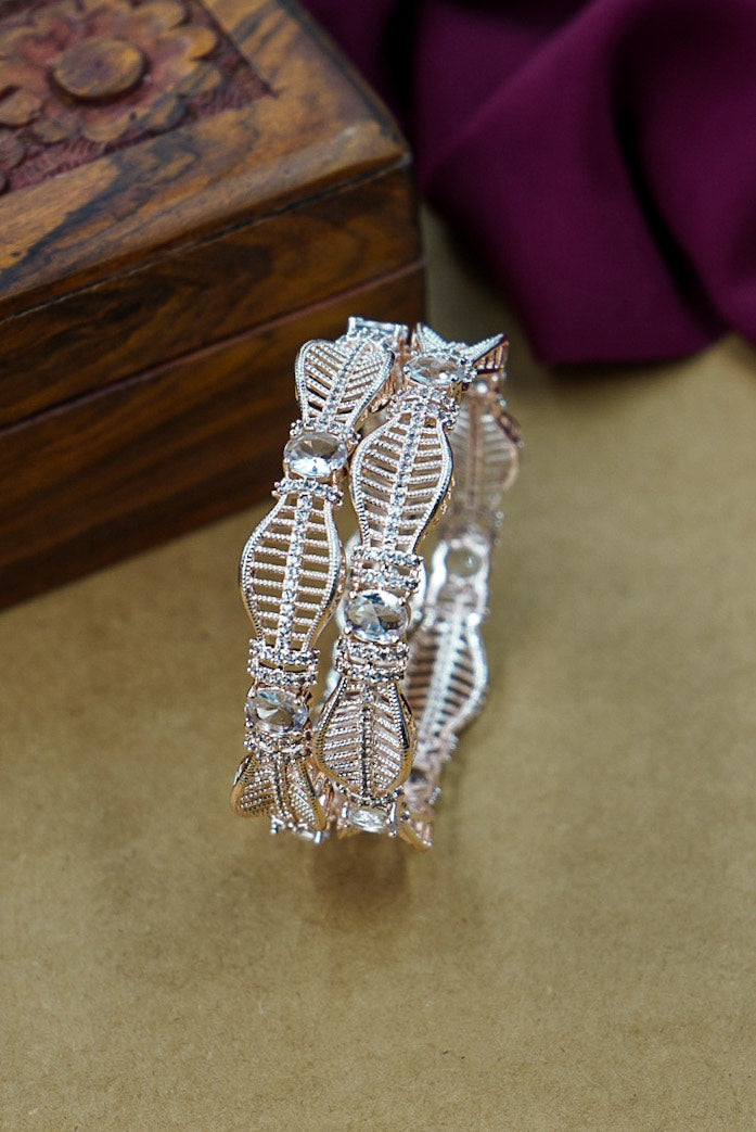 Silver bracelet with intricate design on a brown surface by hitesh bangles